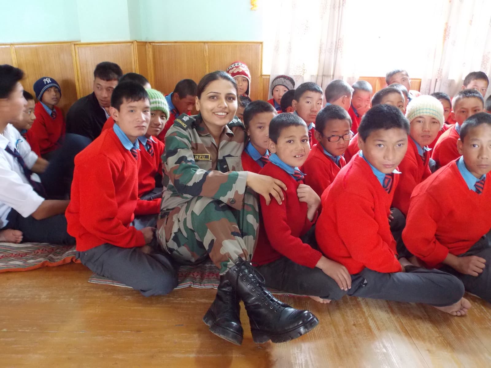 Leader visiting a school and interacting with students